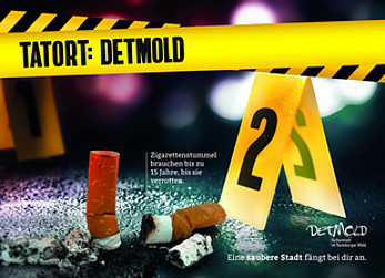"Tatort: Detmold"-Kampagnenbanner, welches Zigarettenstummel auf der Straße zeigt